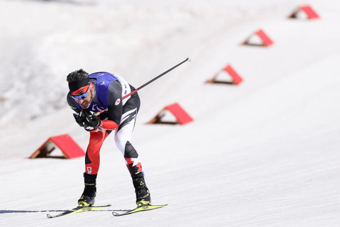 A male Para cross-country skier is racing